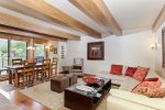 Open living area includes a formal dining area and wood-burning fireplace